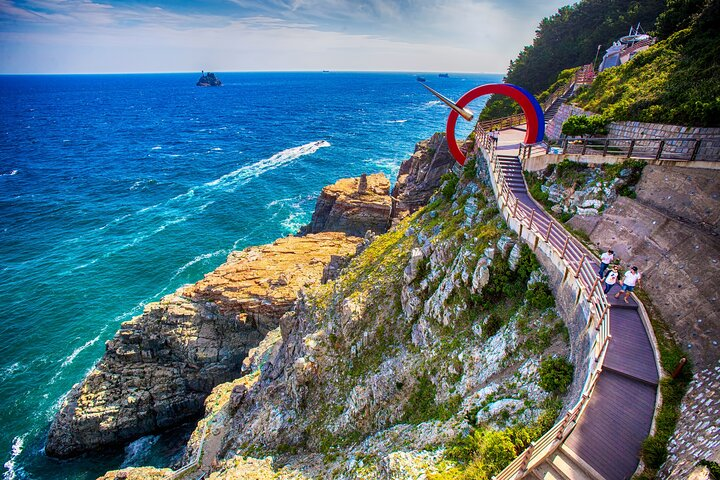 Experience stunning coastal views along the scenic paths of Taejongdae Park where rocky cliffs meet the ocean making it a perfect spot for nature lovers and photographers alike.